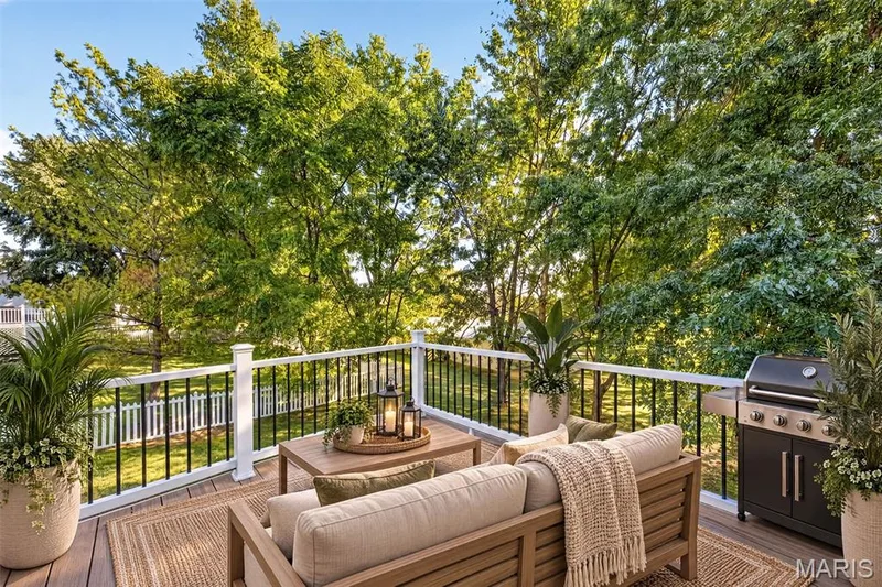 Spacious outdoor deck with composite decking and white and black railing — 155 Snake River Drive, Dardenne Prairie, MO 63368
