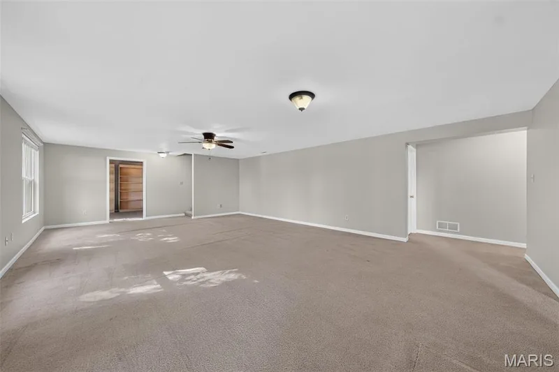 Spacious room featuring carpeting, recessed lighting, and a ceiling fan — 155 Snake River Drive, Dardenne Prairie, MO 63368