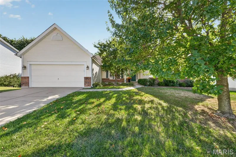 Light-colored siding exterior with a pitched roof — 155 Snake River Drive, Dardenne Prairie, MO 63368