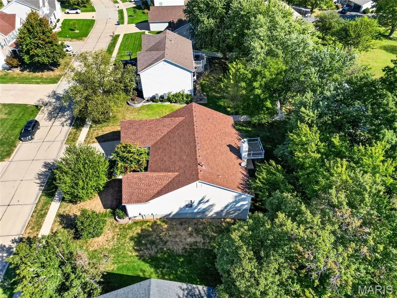 Red shingle roofing with a white siding exterior — 155 Snake River Drive, Dardenne Prairie, MO 63368