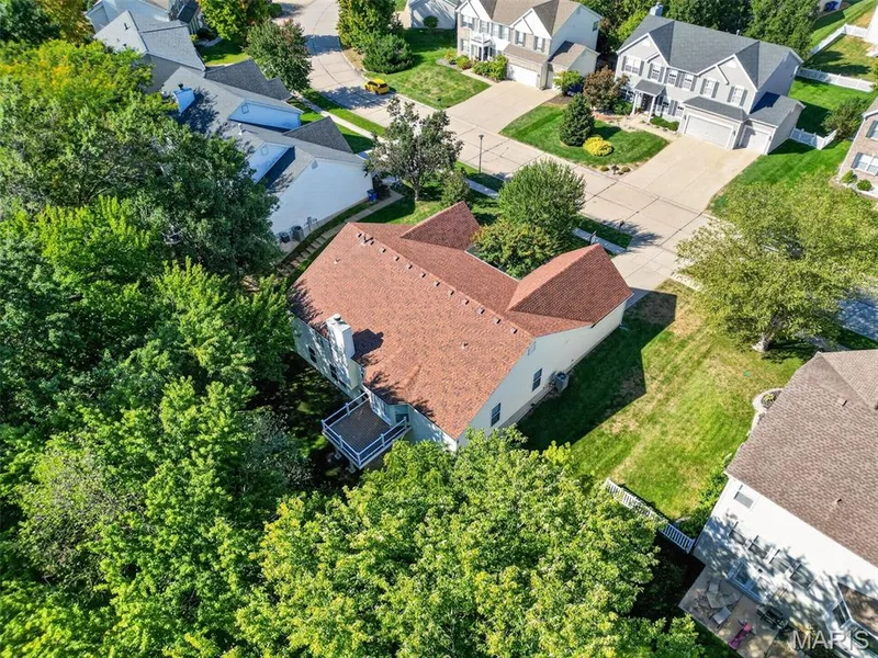 Hip roof with dormers and light-colored siding — 155 Snake River Drive, Dardenne Prairie, MO 63368