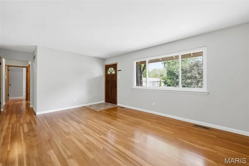 Living Room with Hardwood Flooring and Large Window — 3361 Clemens Court, St Charles, MO 63301