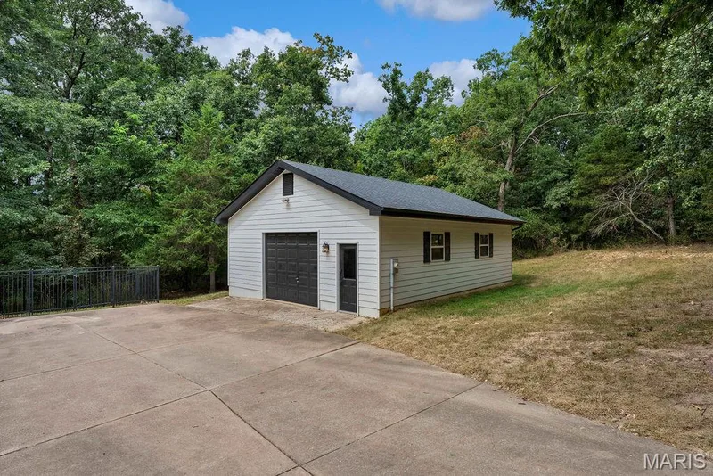 This one has it! At 26'x31' with a garage door & utility door! You could easily park 3 vehicles! — 2 Patrick Lane, Defiance, MO 63341