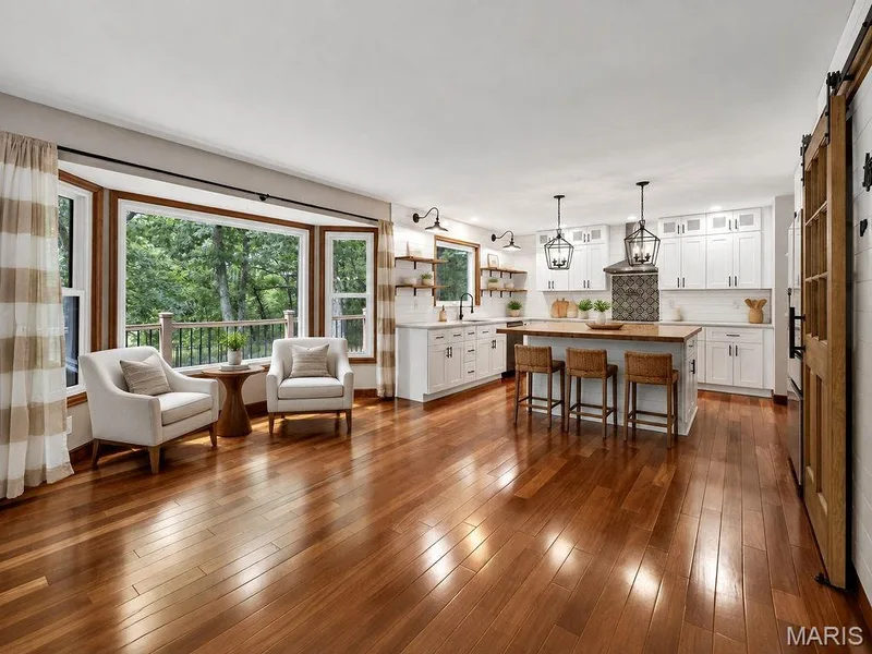 VIRTUALLY STAGED Sitting area and kitchen — 2 Patrick Lane, Defiance, MO 63341