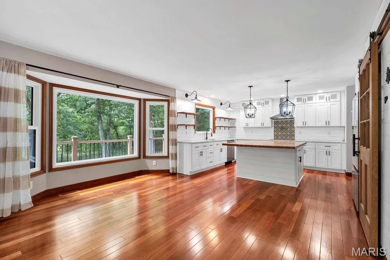Gleaming Brazilian wood floors flow through the majority of the main level. — 2 Patrick Lane, Defiance, MO 63341