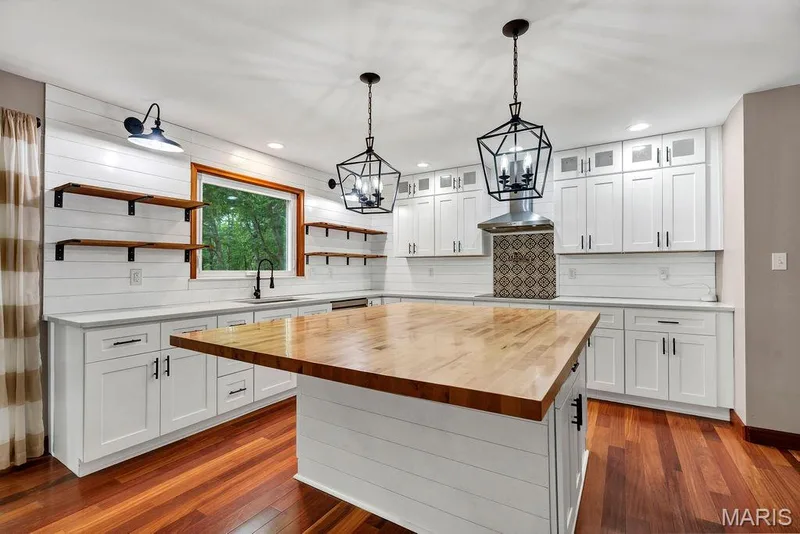 Where to start...36" shaker style cabinets have a glass front topper cabinets - perfect for displaying special pieces. — 2 Patrick Lane, Defiance, MO 63341