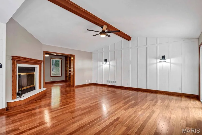 Expansive great room has a board & batten look accent wall. — 2 Patrick Lane, Defiance, MO 63341