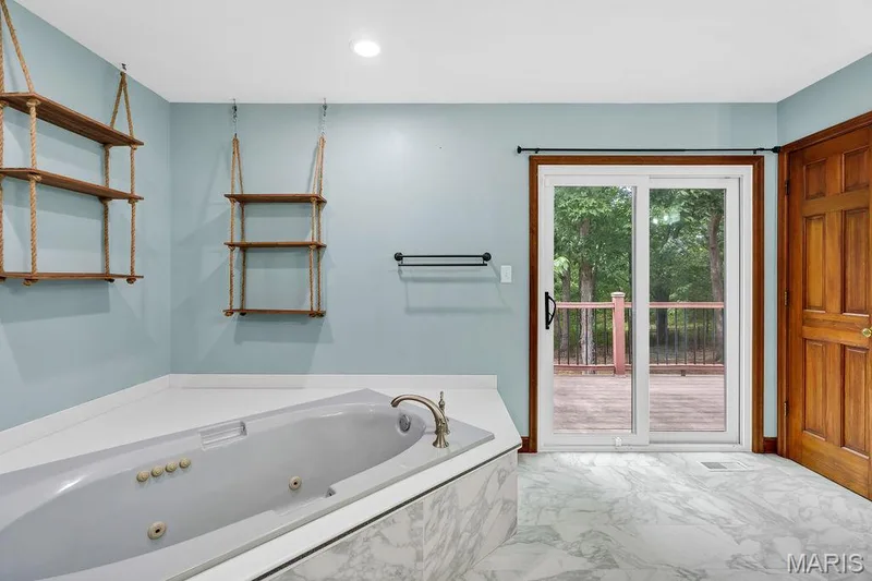 Spacious and relaxing primary bathroom allows access to the deck! — 2 Patrick Lane, Defiance, MO 63341