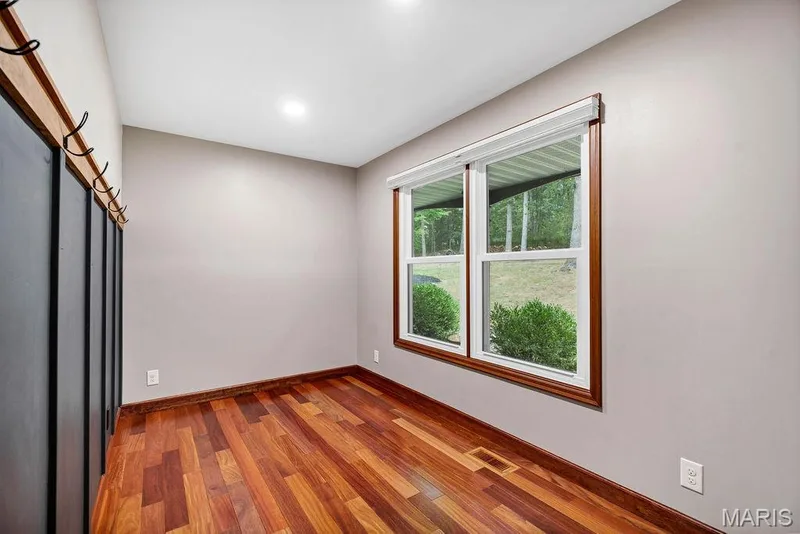 Study is at the front of the home and has a board & batten look accent wall and a barn door style door. — 2 Patrick Lane, Defiance, MO 63341
