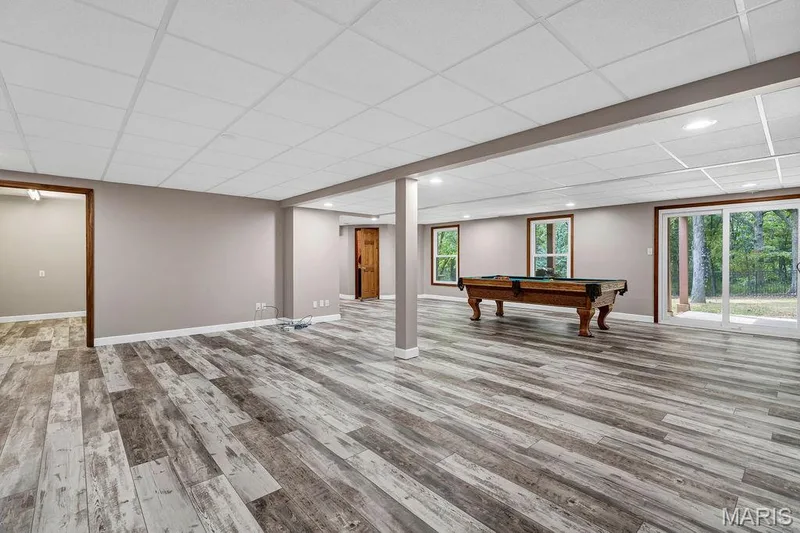 If the main and upper levels didn't have enough living space, you can come down to the mostly finished walk-out basement! — 2 Patrick Lane, Defiance, MO 63341