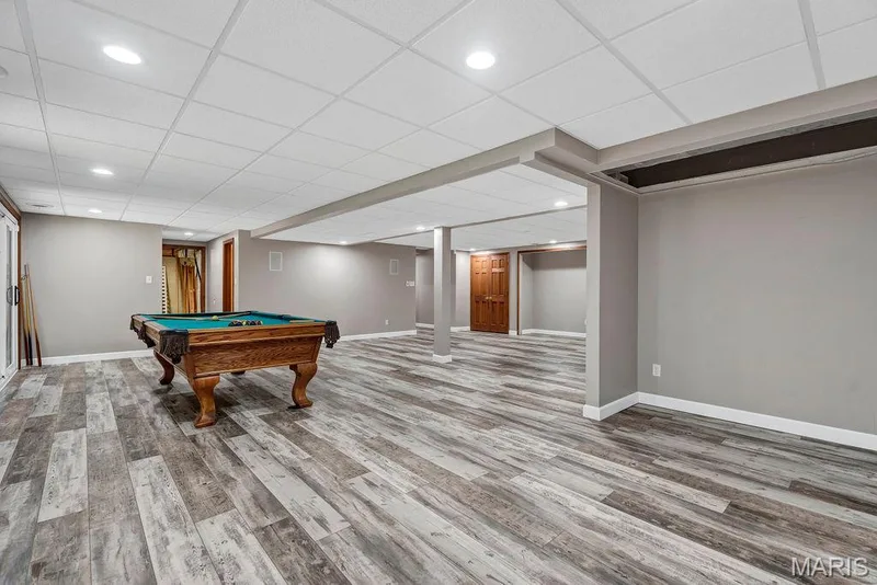 There is so much room for relaxing or entertaining. This space to the right of the photo used to be a small kitchenette - there is still plumbing that could be nice for a bar area too. — 2 Patrick Lane, Defiance, MO 63341