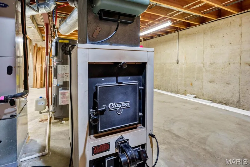 I mentioned there were TWO furnaces and TWO air conditioners...THIS is the wood-burning furnace that can be used to heat the main floor! — 2 Patrick Lane, Defiance, MO 63341