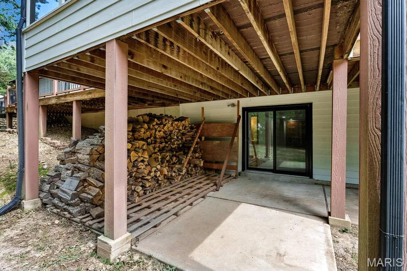 Covered patio area underneath the deck. — 2 Patrick Lane, Defiance, MO 63341
