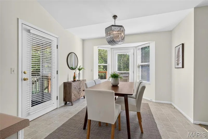 Breakfast area in kitchen with door to screen porch — 7235 Picasso Drive, Dardenne Prairie, MO 63368
