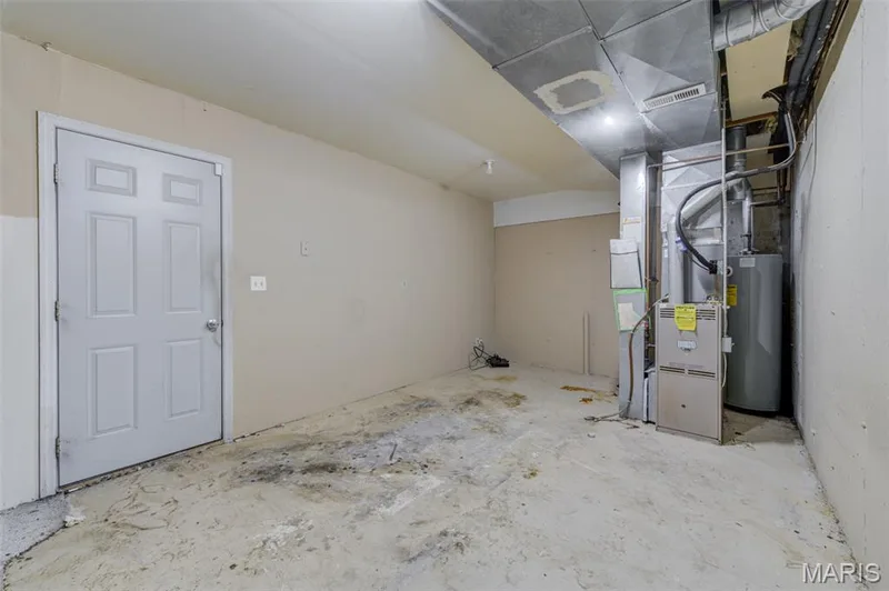 Unfinished basement that leads into the garage — 4306 Sherman Park Drive #10F, St Charles, MO 63303