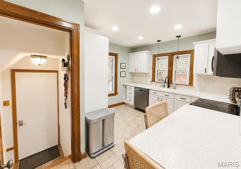 kitchen view with view of backdoor and basement stairs to the left of back door — 1029 Jackson Street, St Charles, MO 63301