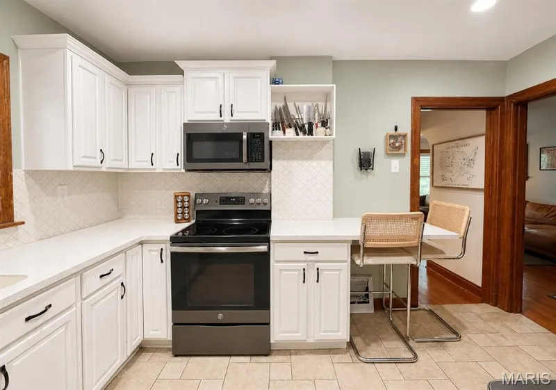 kitchen view leading to hall and dining area — 1029 Jackson Street, St Charles, MO 63301
