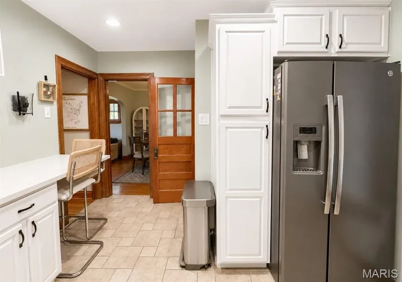 kitchen view leading to hall and dining area — 1029 Jackson Street, St Charles, MO 63301
