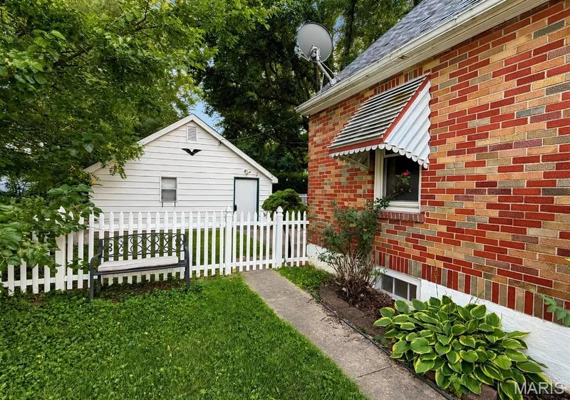 side of home leading to backyard — 1029 Jackson Street, St Charles, MO 63301
