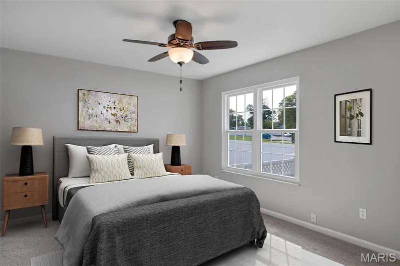 Carpeted flooring, a ceiling fan with integrated lighting, and multiple electrical outlets — 857 Du Pre Court, St Peters, MO 63376