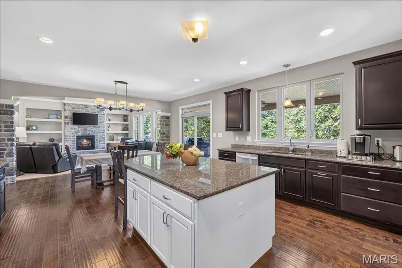 Kitchen featuring large center island with granite counters — 1307 Homestead Heights Drive, Wildwood, MO 63005