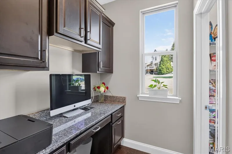 Handy home office area off of kitchen and adjacent to walk-in pantry — 1307 Homestead Heights Drive, Wildwood, MO 63005