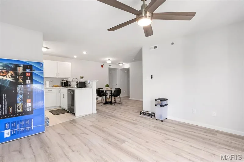 Turn around to appreciate the seamless connectivity of the floor plan, perfectly joining the living room, kitchen, and dining area for effortless entertaining. — 4101 Spring Creek Lane, O'Fallon, MO 63368
