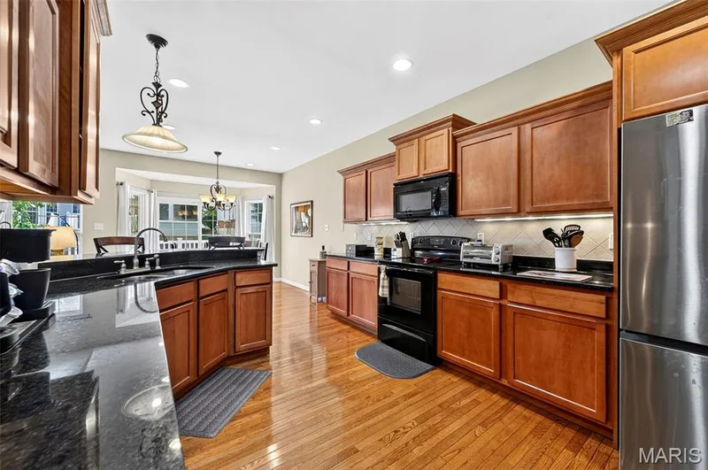 Crown molding on cabinetry and soft close  doors with roll-outs in cabinets — 18 Eagle Bluff Lane, St Charles, MO 63303