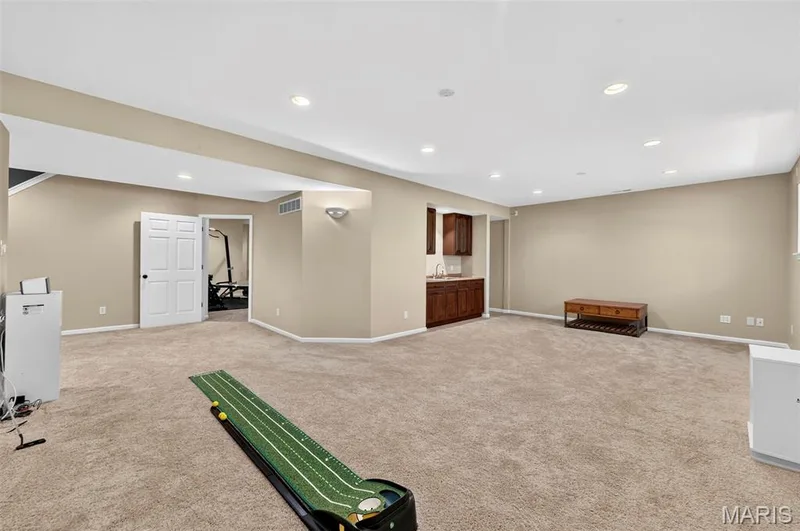 Spacious Family Room w/ plenty of recessed lighting ~ wide open entertaining space! — 18 Eagle Bluff Lane, St Charles, MO 63303