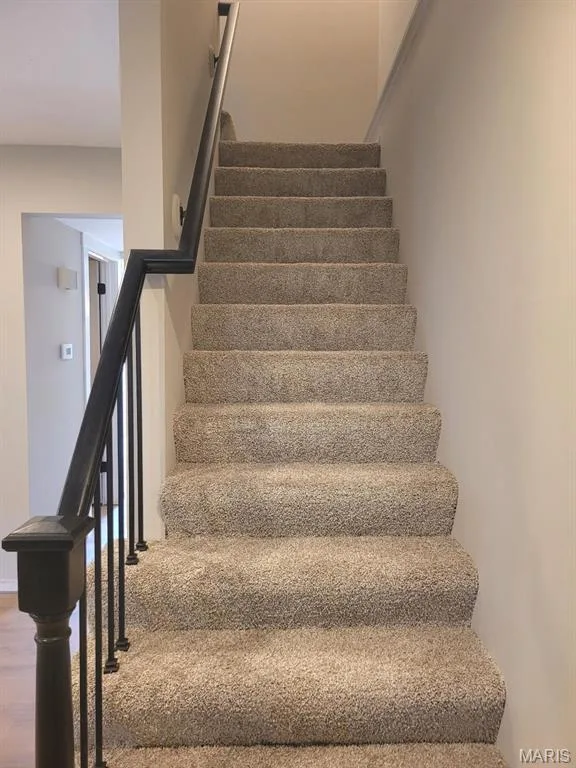 Staircase features new carpet & updated handrailings. — 39 Park Charles Boulevard S #D, St Peters, MO 63376