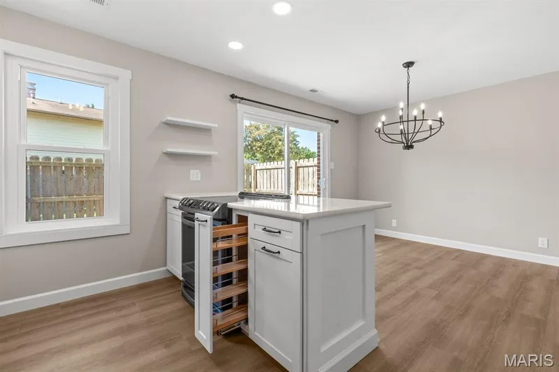 Featuring soft close cabinets & drawers including a built in spice rack and trash can cabinet — 39 Park Charles Boulevard S #D, St Peters, MO 63376