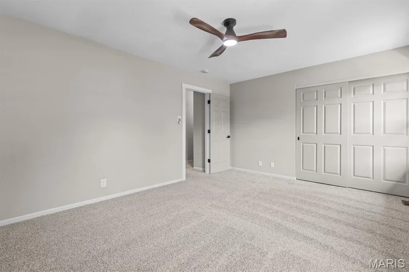 Freshly painted primary bedroom with ceiling fan & brand new carpeting — 39 Park Charles Boulevard S #D, St Peters, MO 63376