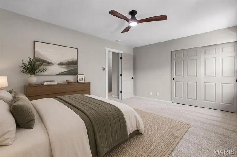 Virtually staged primary bedroom — 39 Park Charles Boulevard S #D, St Peters, MO 63376