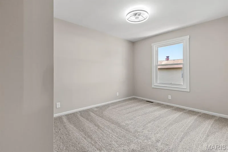 Bedroom 2 features fresh paint, new carpet, window and a fandelier! — 39 Park Charles Boulevard S #D, St Peters, MO 63376