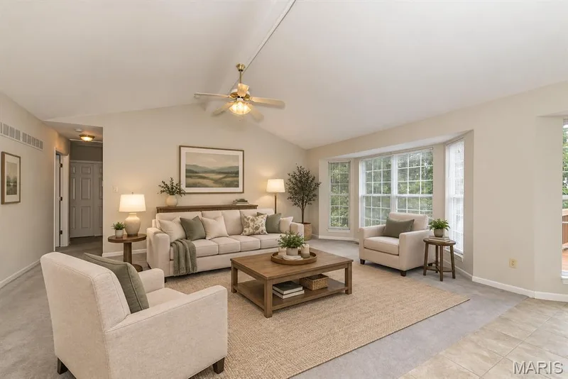Great room with Vaulted ceiling and bay window.  Virtually staged — 17027 Old Hollow Drive, Wildwood, MO 63040