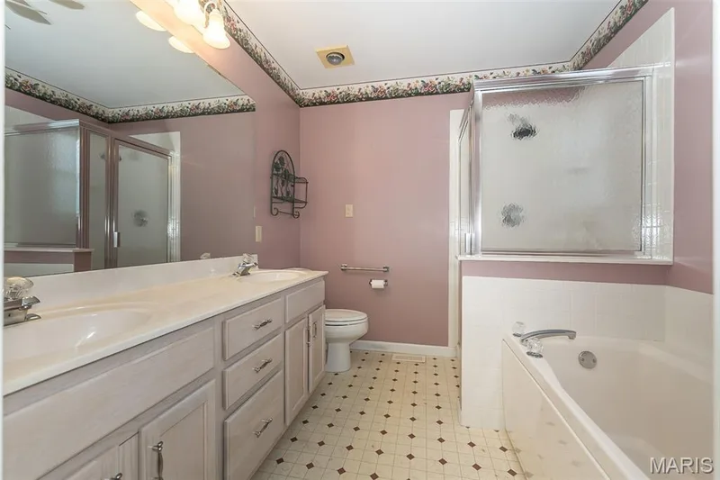 Primary bath with double vanity, tub and separate shower — 17027 Old Hollow Drive, Wildwood, MO 63040