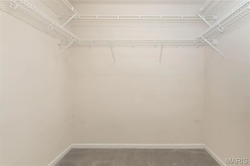 Primary bedroom walk in closet — 17027 Old Hollow Drive, Wildwood, MO 63040