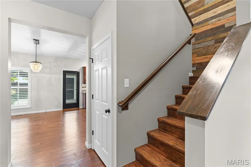 Wood-finish flooring throughout the main level — 3222 Starkville Street, St Charles, MO 63301