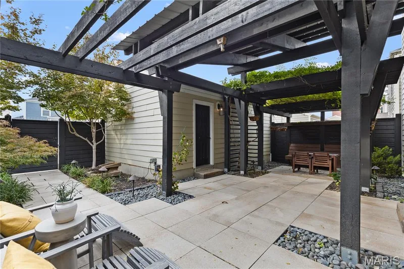 Paved patio with dark wood pergola — 3222 Starkville Street, St Charles, MO 63301