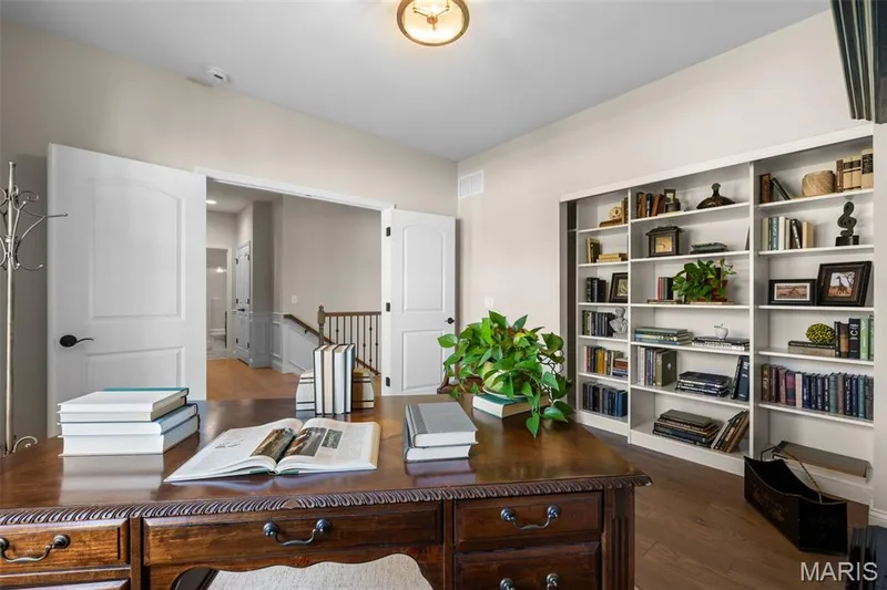 Recessed lighting, wood-finish flooring, white built-in shelving, and light-colored walls — 193 Santa Elena Drive, Wentzville, MO 63385