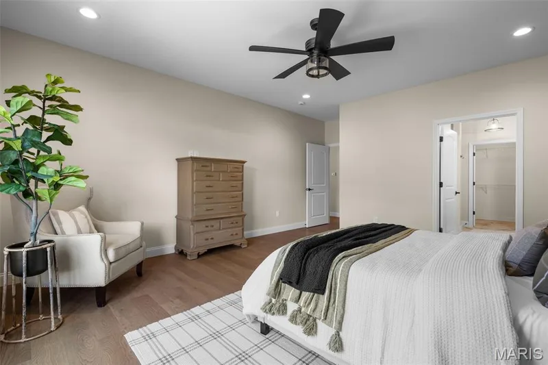 Recessed lighting, wood-finish flooring, ceiling fan, and a walk-in closet with built-in shelving — 193 Santa Elena Drive, Wentzville, MO 63385