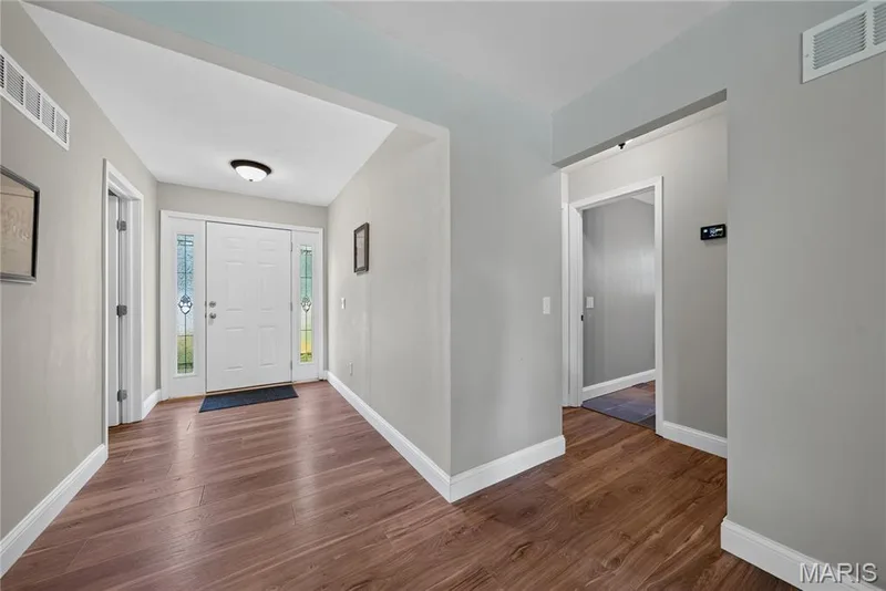 Entry foyer with hardwood floors — 72 Champagne Drive, Lake St. Louis, MO 63367