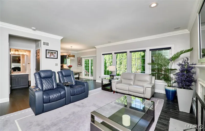Recessed lighting, crown molding, dark wood-finish flooring, multiple windows, and a built-in vanity with dual sinks — 264 Greenshire Lane, Dardenne Prairie, MO 63368