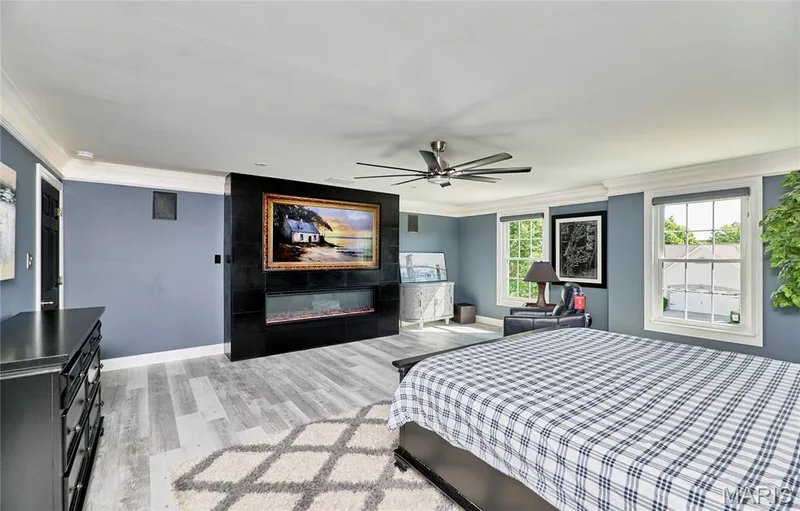 Modern plank flooring, recessed lighting, ceiling fan, and crown molding — 264 Greenshire Lane, Dardenne Prairie, MO 63368