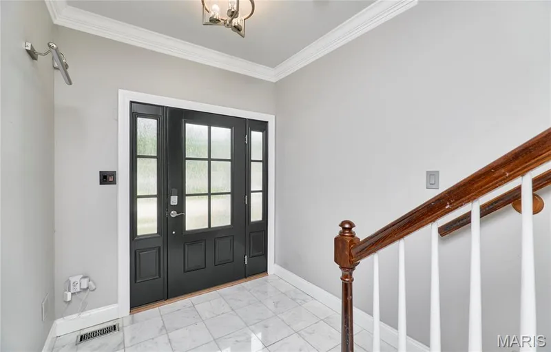 Entryway featuring a paneled door with sidelights, transom window, and a tile floor — 264 Greenshire Lane, Dardenne Prairie, MO 63368