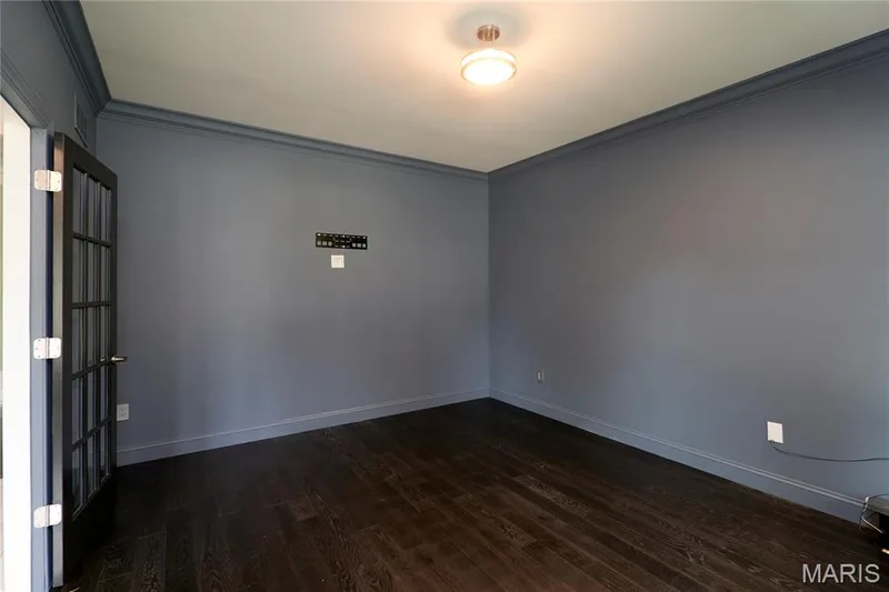 Dark wood-finish flooring with coordinating baseboards — 264 Greenshire Lane, Dardenne Prairie, MO 63368