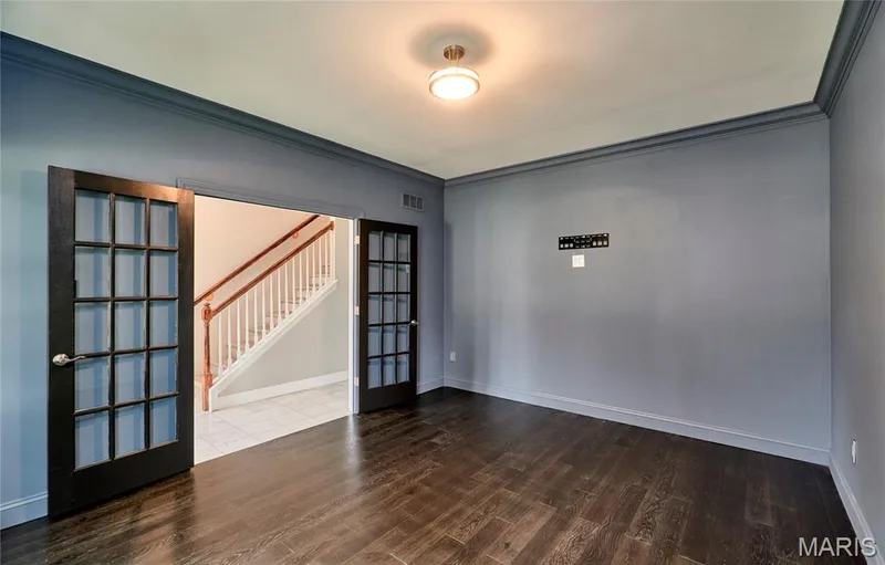 Dark wood-finish flooring with a herringbone pattern — 264 Greenshire Lane, Dardenne Prairie, MO 63368