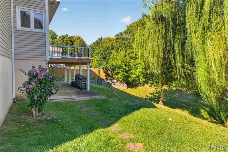 covered patio with 2 door to lower level — 3445 Riverchase Parkway, St Charles, MO 63301