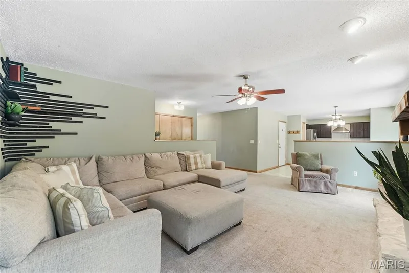 Great Room with view into kitchen/dining — 8 Ardwick Drive, St Peters, MO 63376