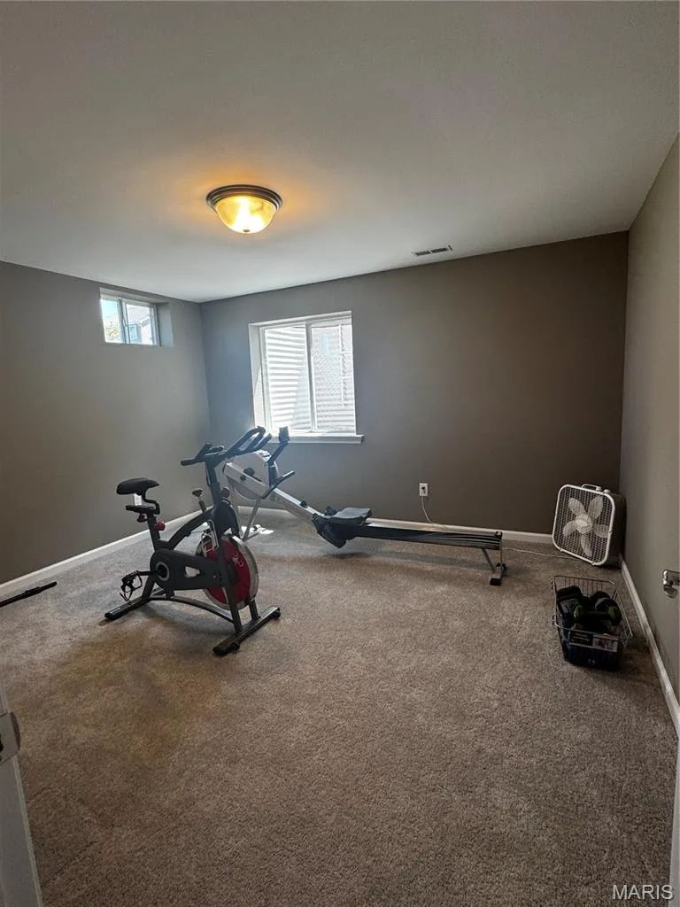 Neutral-toned carpeting throughout — 401 Copperfield Court, St Charles, MO 63301
